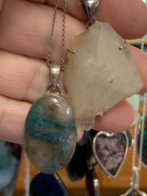 Two gemstone pendants on silver chains